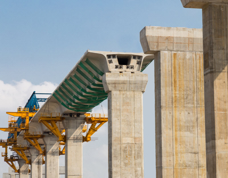 Construction of a mass transit train line in progress with heavy infrastructure