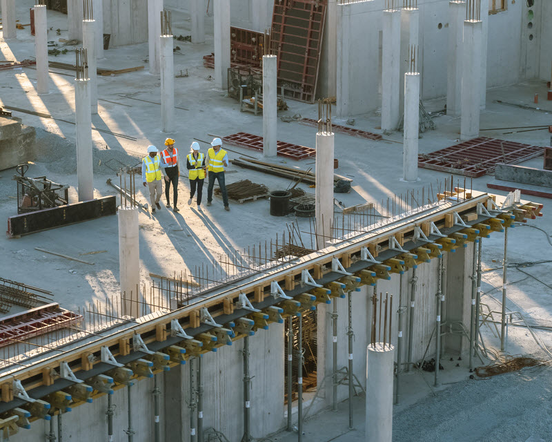 Team of engineers in a big construction site