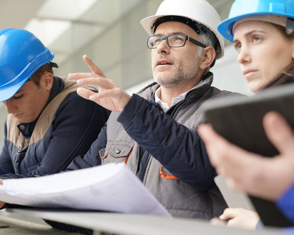 Instructor with young people in engineering training