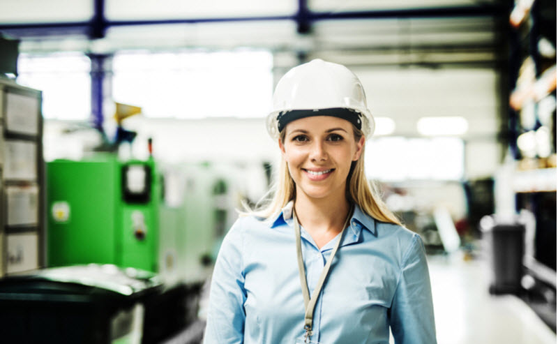 Industrial woman engineer standing in a factory