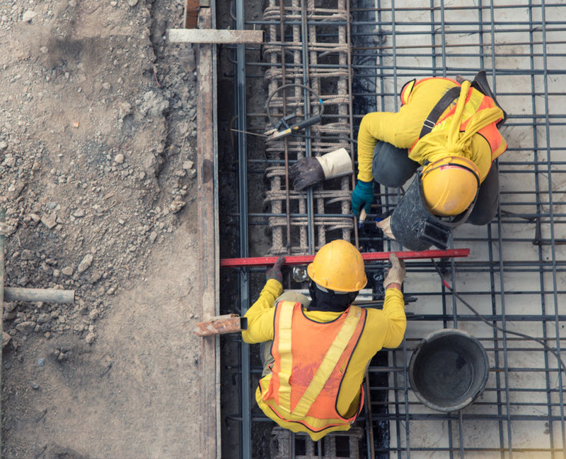 Two construction workers at construction site