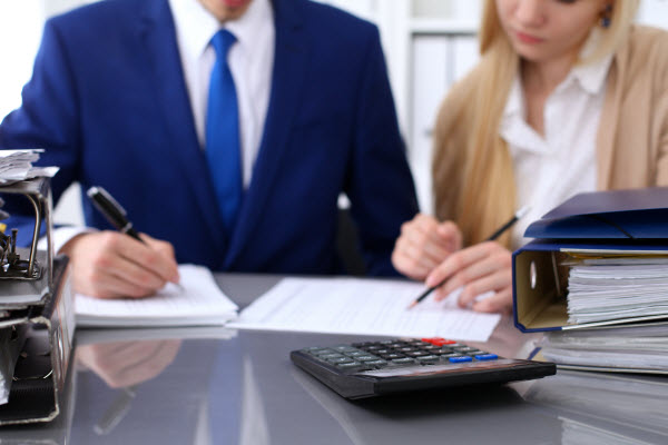 Business people working on a document at the office table